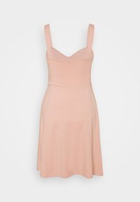 Mjuk rosa klänning med åtsittande liv och utsvängd kjol. Har breda axelband och en V-ringning, tillverkad av elastisk bomullsduk.