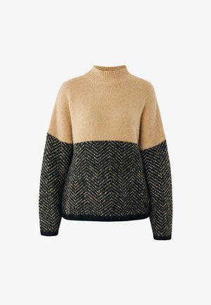 Jersey para mujer en beige y negro con cuello alto, mangas largas y patrón de flecha en la parte inferior y mangas.