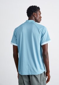 Nike Sportswear AIR - Polo majica - denim turq/glacier blue/white