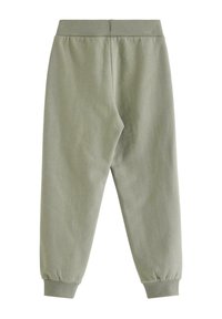 Lysegrønne, mellemvægtige joggingbukser med ribstrikket talje og manchetter. Blød tekstur, tilspidsede ben, uden synlige mønstre eller detaljer.