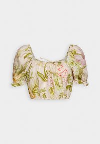 Blouse cropped à manches bouffantes avec ourlet élastique et lien au col en beige, ornée d'un imprimé floral rose et vert.
