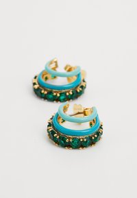 Gold hoop earrings featuring teal accents and emerald green gemstones, with a smooth, shiny finish and a layered design.