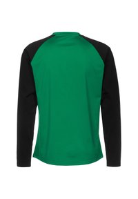 Langarmshirt met een groene body en zwarte raglanmouwen. Gemaakt van soepel materiaal, voorzien van een ronde halslijn en een gebogen zoom.