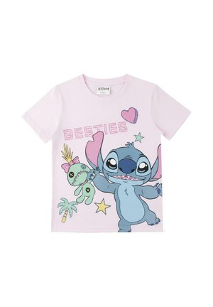 Light pink children’s t-shirt with cartoon Stitch holding a voodoo doll, surrounded by stars, a palm tree, hearts, and "BESTIES" text.