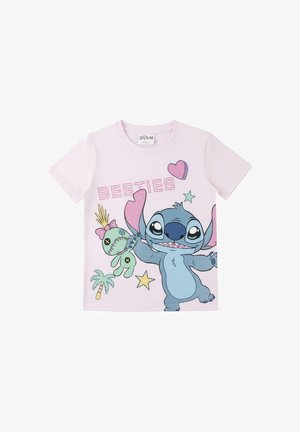 Light pink children’s t-shirt with cartoon Stitch holding a voodoo doll, surrounded by stars, a palm tree, hearts, and "BESTIES" text.