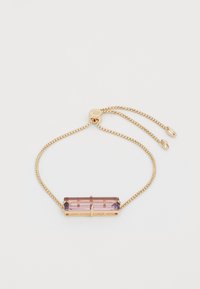 Bracciale in catena d'oro con una pietra centrale rettangolare di cristallo viola, chiusura regolabile con piccole perline dorate alle estremità.