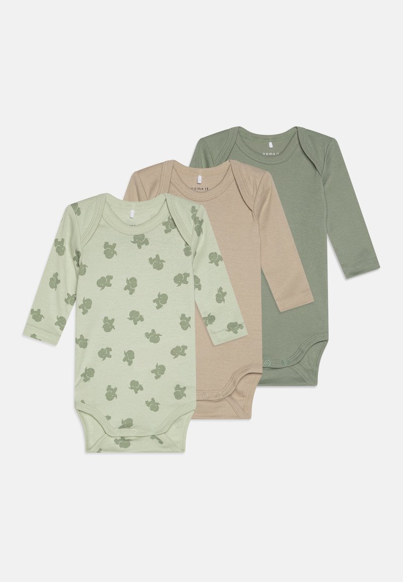 Trys ilgomis rankovėmis bodysuit'ai, pagaminti iš švelnios medvilnės; spalvos – šviesiai žalia su raštu, smėlinė ir prigesinta žalia. Papildomos savybės – mygtukų užsegimai apačioje.