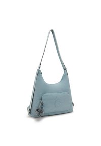 Light blue shoulder bag with a front zipper pocket, round logo patch, adjustable strap, and small plush monkey keychain attached.