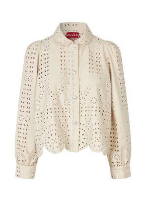 Blouse beige à manches longues avec broderie œillet, ourlet festonné, épaules bouffantes, devant boutonné et col arrondi.