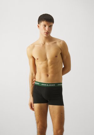 Zwarte boxershorts met een groene tailleband met witte tekst "JACK & JONES." De stof lijkt glad, met een getailleerd ontwerp.