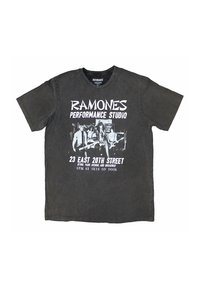 Black cotton t-shirt featuring a white graphic print of the Ramones with text about a performance studio event. Short sleeves, crew neck.