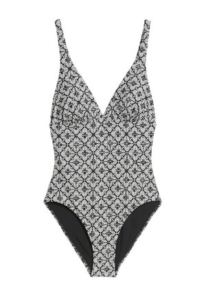 Costume da bagno intero con pattern bianco e nero, scollatura profonda, spalline regolabili e parte inferiore nera a tinta unita.
