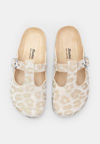 Beige leather clogs with a leopard print pattern, open sides, and a silver buckle accent. Textured surface with a smooth interior lining.