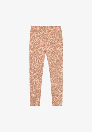 Oranje legging met een crèmekleurig abstract luipaardprintpatroon, voorzien van een rekbare tailleband en een gladde textuur.