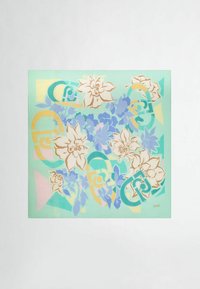 Foulard quadrato in seta con sfondo verde menta, motivi floreali in colori pastello e accenti geometrici in giallo e blu.