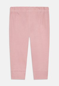 Hellrosa Baumwollleggings mit elastischem Bund, glatter Textur und gesäumten Abschlüssen. Keine Muster oder zusätzlichen Akzente vorhanden.