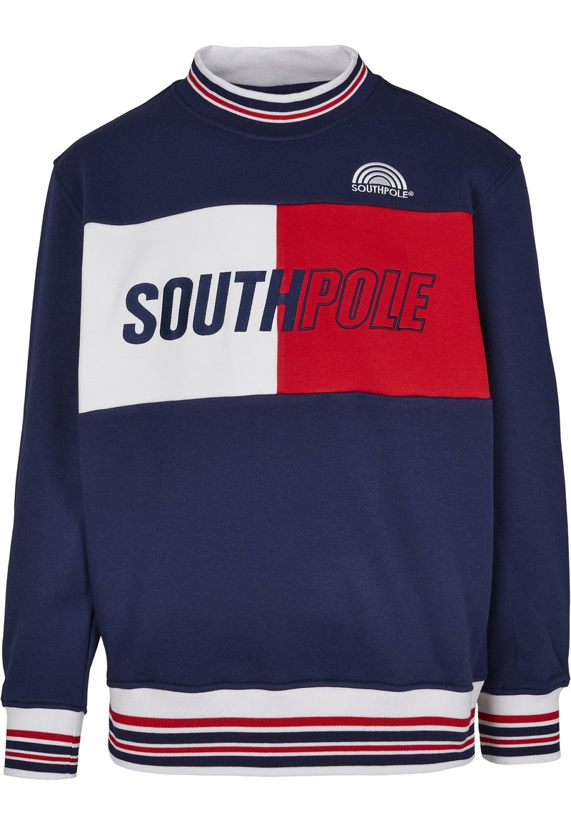 Námořnická modrá mikina s červenými a bílými bloky, textem "SOUTHPole", žebrovaným límcem a pruhovanými manžetami a lemem. Měkká tkanina.