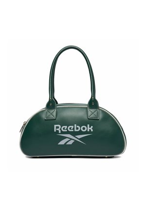 Ciemnozielona torebka Reebok o zaokrąglonym kształcie, z dwoma uchwytami, białym logo i zamkiem błyskawicznym, na białym tle.