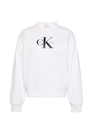 Felpa bianca con scollo rotondo, maniche lunghe, polsini e orlo a costine. Presenta un grande logo nero 'CK' sul davanti e una texture morbida.