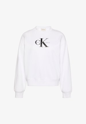 Felpa bianca con scollo rotondo, maniche lunghe, polsini e orlo a costine. Presenta un grande logo nero 'CK' sul davanti e una texture morbida.