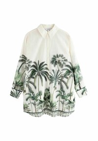 Witte shirt met palmboom- en bladprint, met kraag, lange mouwen, met een gegolfde zoom en groene accenten bij de manchetten en onderkant.