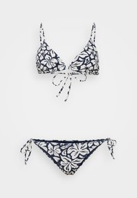 Tengerészkék bikini szett fehér virágmintával. Trianguláris melltartó, megkötős zárással, állítható pántokkal; passzoló alsó rész oldalsó megkötőkkel.