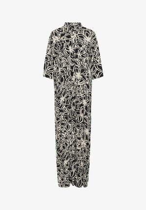 Musta ja kermavärinen kukkakuosiset haalarit, lyhyet hihat, nappikiinnitys edessä, rento malli, kevyttä kangasta, suora siluetti ja taskut.