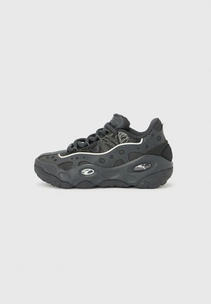 Dark grey athletic sneaker with thick sole, mesh and circular pattern details, lace-up front, and brand logos on the side.
