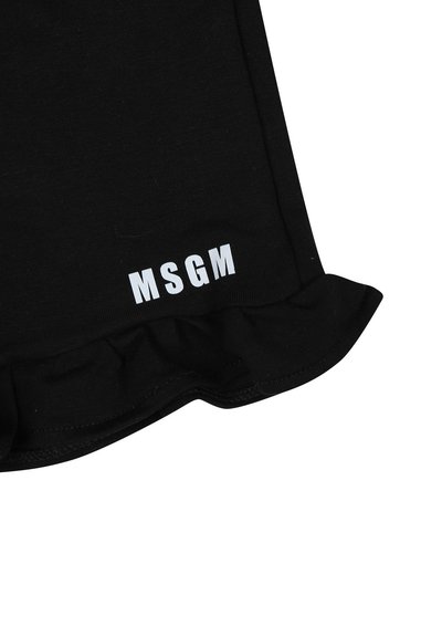 Gonna nera di cotone con orlo arricciato. Presenta un logo bianco "MSGM" in basso. Texture liscia e design aderente.