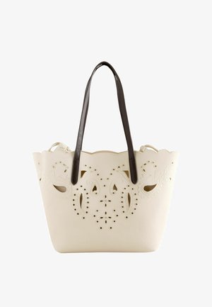 Kremfarvet mulepose med bølgede kanter, laserudskårne paisley-mønstre og mørkebrune skulderremme.