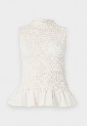 Αμάνικη κρεμ μπλούζα με ραφές, ψηλό λαιμό και βολάν στην άκρη, κατασκευασμένη από υφασμάτινο ελαστικό ύφασμα με υφή και ελαφρώς φαρδύ τελείωμα.