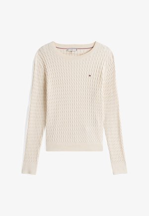 Krém színű pulóver texturált gyémánt mintával, bordázott kerek nyakkivágással és hosszú ujjal. Kicsi logó található a mellen.