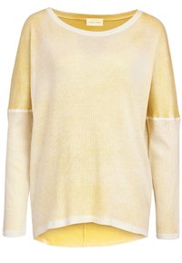 Pitkähihainen paita vaaleankeltaisena ja kermana, jossa on rento istuvuus, ribbikuvio ja leveä kaula-aukko. Helma on lievästi kaareva.