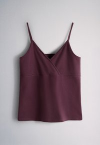 Sleeveless dark purple camisole top with thin straps and a wrap-style V neckline on a plain light background.