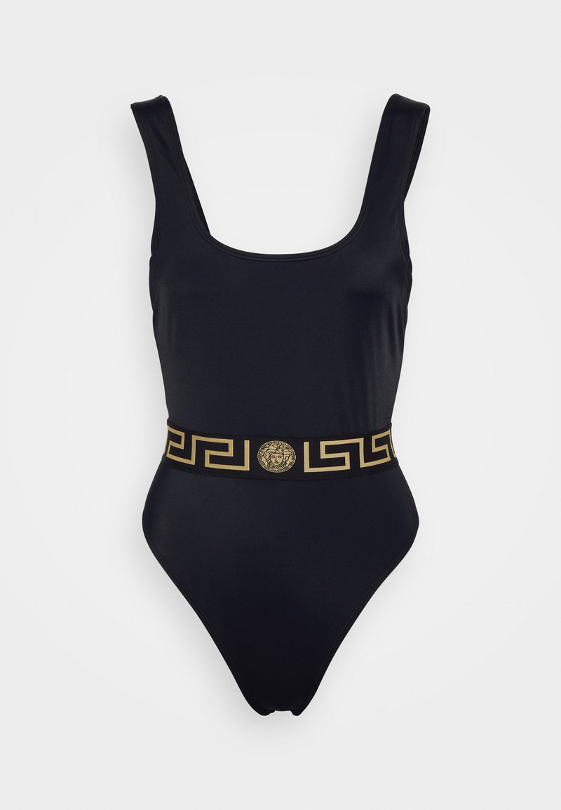 Black one-piece swimsuit with a square neckline, thick straps, and a gold decorative belt featuring a Greek key pattern and a central emblem.