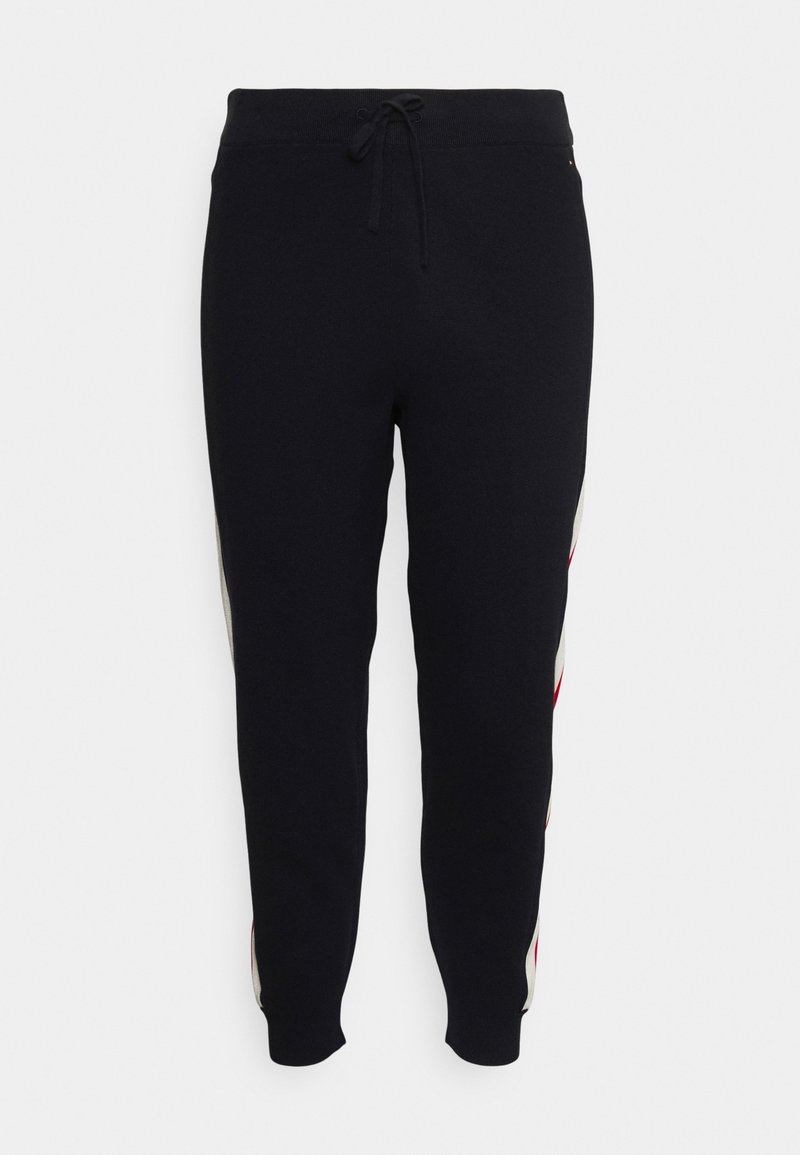 Schwarze Sweatpants mit elastischem Bund und Kordelzug. Mit seitlichen Streifen in Rot und Weiß. Eng anliegende Bündchen. Weiches, strukturiertes Gewebe.