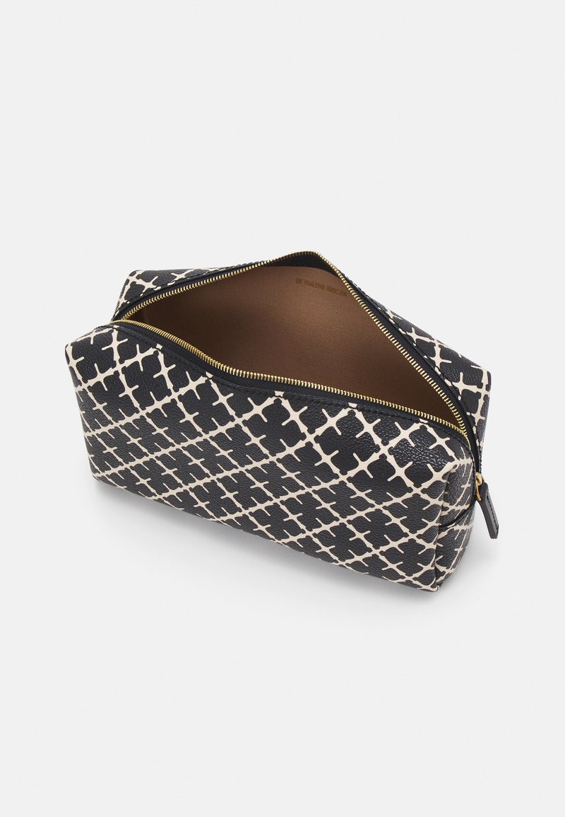 Zip-top cosmetic bag with a geometric black and white pattern, made of textured material. Interior is a solid beige color.