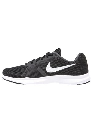 Sort Nike løbesko med hvid swoosh-logo, sorte snørebånd, tekstureret mesh-overdel og hvid sål set fra siden.