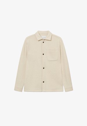 Μπεζ φλις πουκάμισο-τζάκετ με γιακά, μακρύ μανίκι και μπροστινή τσέπη; διαθέτει μαύρα κουμπιά και μαλακή, υφασμένη επιφάνεια.