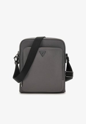 Gray crossbody bag with a textured finish, zippered front pocket, adjustable strap, and a triangular logo accent on the front.