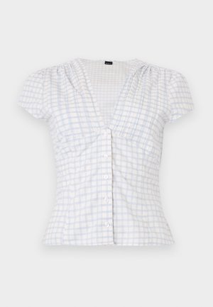 White short-sleeve blouse with light blue checkered pattern, V-neck, button-down front, and slight puffed shoulder design.