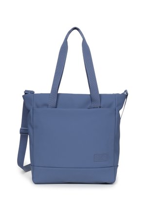 Blue rectangular tote bag made of durable fabric. Features dual handles, a detachable shoulder strap, and a subtle logo patch on the front.