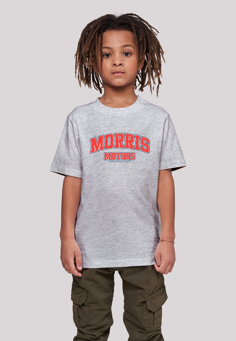 Gray short-sleeve t-shirt with "MORRIS MOTORS" in red and black text; paired with olive green cargo pants, smooth fabric texture.