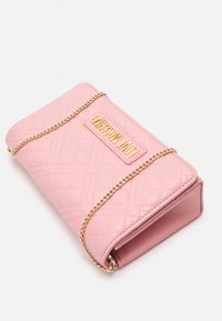 Pink quilted leather crossbody bag with gold chain strap and gold "LOVE MOSCHINO" logo plaque on front flap.