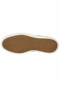 Suela de zapato con una base de goma beige suave, con surcos ondulados para tracción, bordeada por una media suela blanca.
