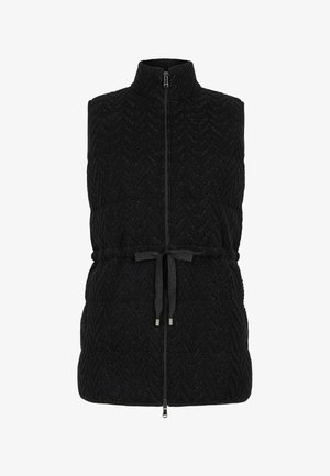 Black, sleeveless vest with high collar, featuring a zip closure and a drawstring tie at the waist. Textured zigzag pattern throughout.