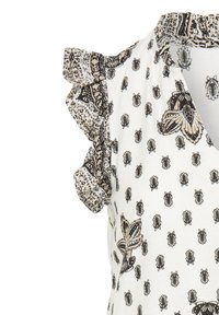 Blouse blanche sans manches avec motifs floraux et d’abeilles noirs et beiges, avec des manches courtes à volants aux motifs complexes.