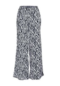 Zwart-witte wijde broek met een draaiend dierenpatroon. Elastische tailleband, lichtgewicht stof en uitlopende vorm.