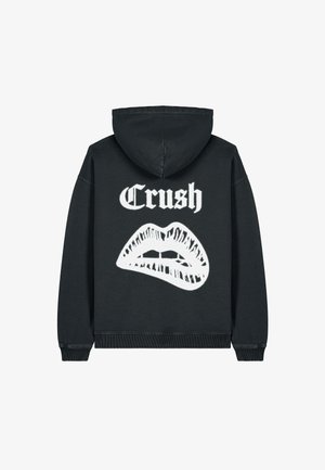 Zwarte hoodie met de witte tekst "Crush" en een grafisch ontwerp van lippen. Gemaakt van zacht materiaal, met ribgebreide manchetten en onderrand.