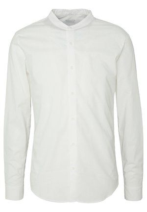 Valkoinen nappikauluspaita, jossa on mandariinikaulus, pitkät hihat ja sileä, teksturoitu puuvillakangas. Huomaamaton ompelu yksityiskohta etupaneelin varrella.